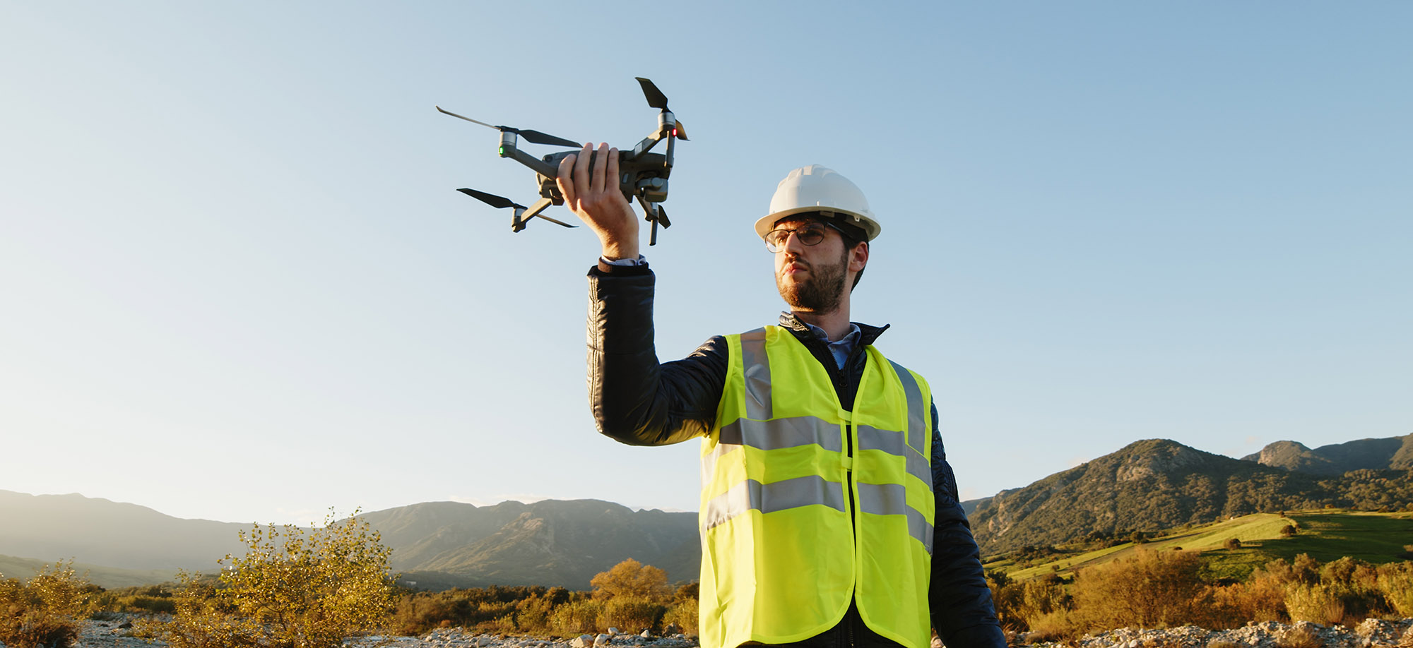 engineer with drone controls the territory