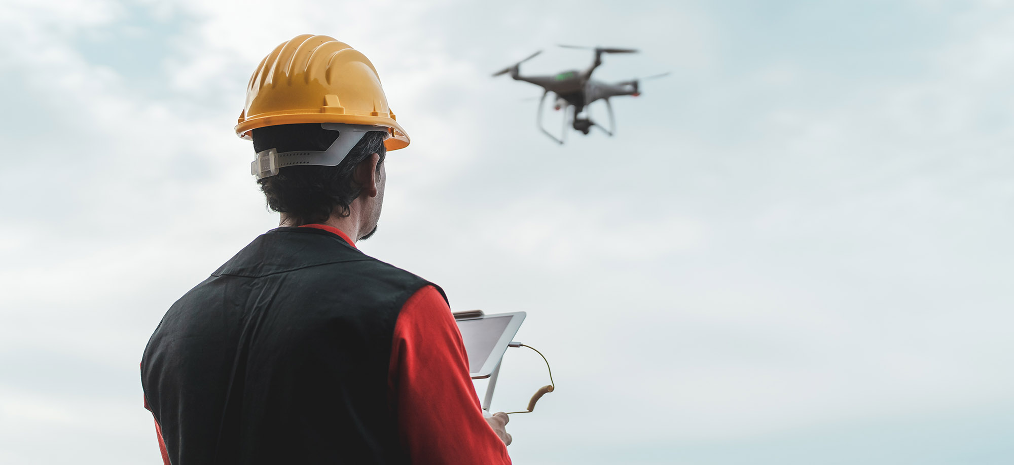 engineer with drone controls the territory